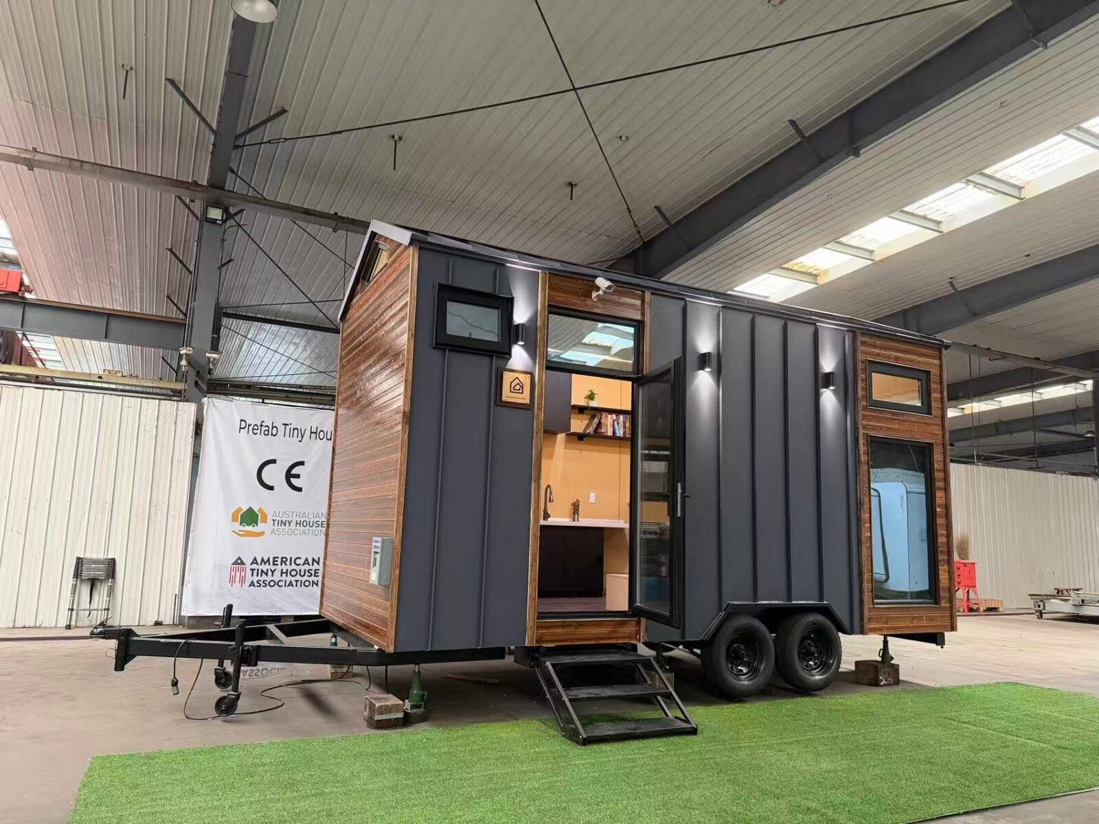 A fleet of steel-framed tiny houses ready for international delivery.