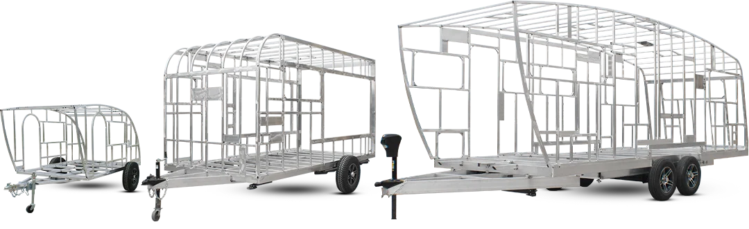 Laser-Cut Aluminium Frames Laser-cut aluminium tiny house frames in three sizes, showing precision-manufactured lightweight structural framework on trailers