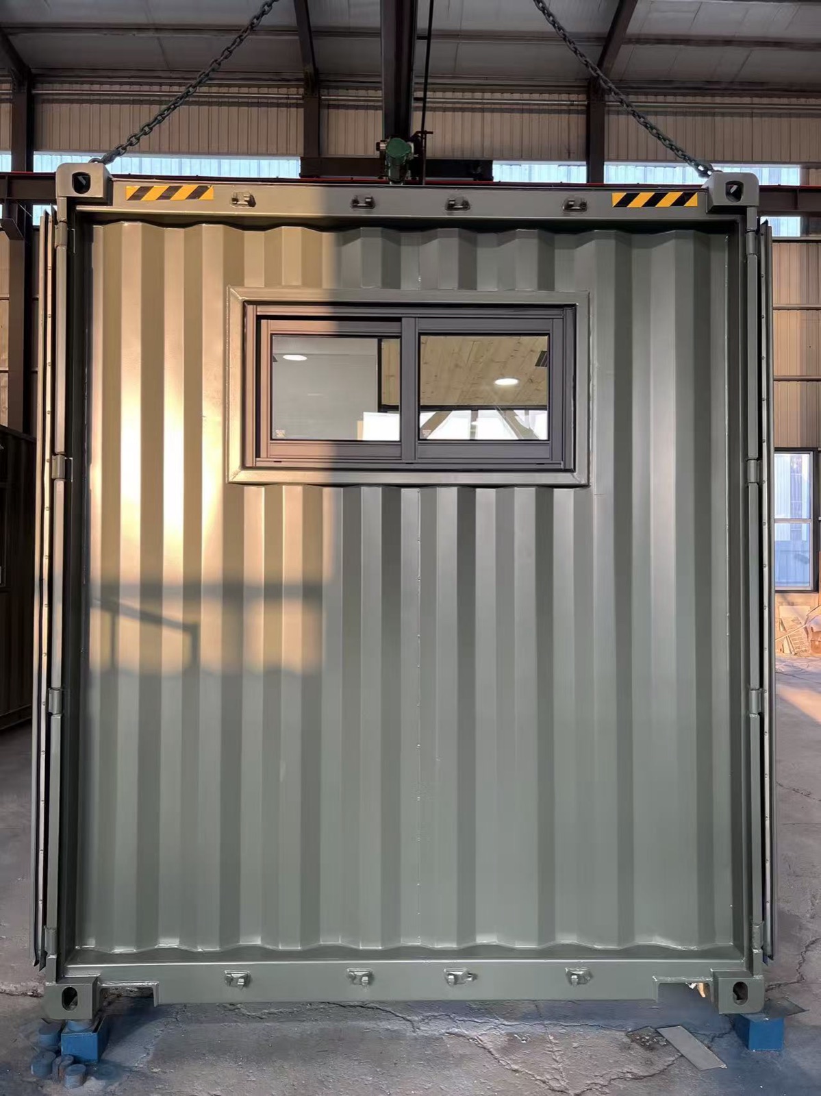 Magic Iron 20ft container with window cut in, on the production line