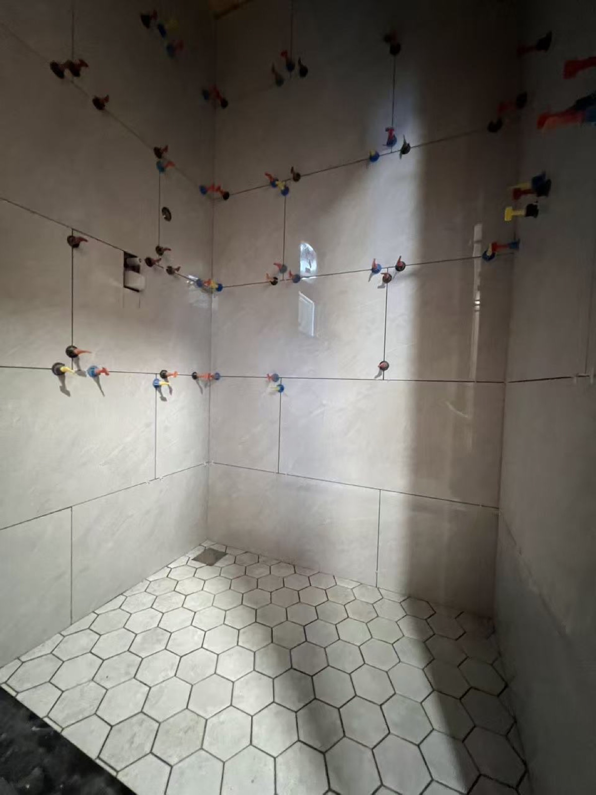 Magic Iron bathroom during fit-out — tiling complete, fixtures to follow