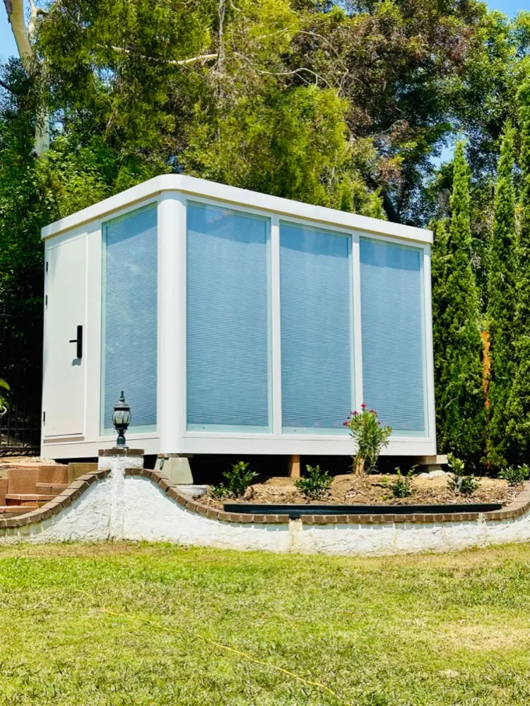 Completed MagicNest backyard office with blinds fitted and landscaping finished