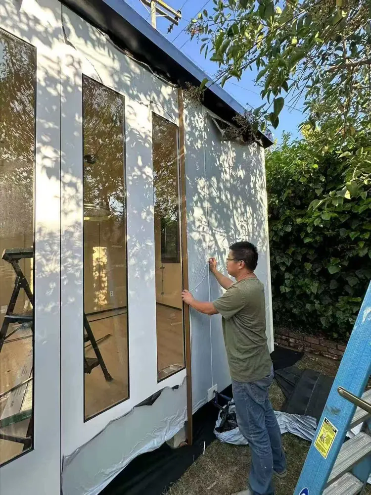 Peeling the protective film off the MagicNest cladding during final finishing